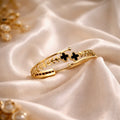 MIDNIGHT CLOVER OPEN CUFF BRACELET