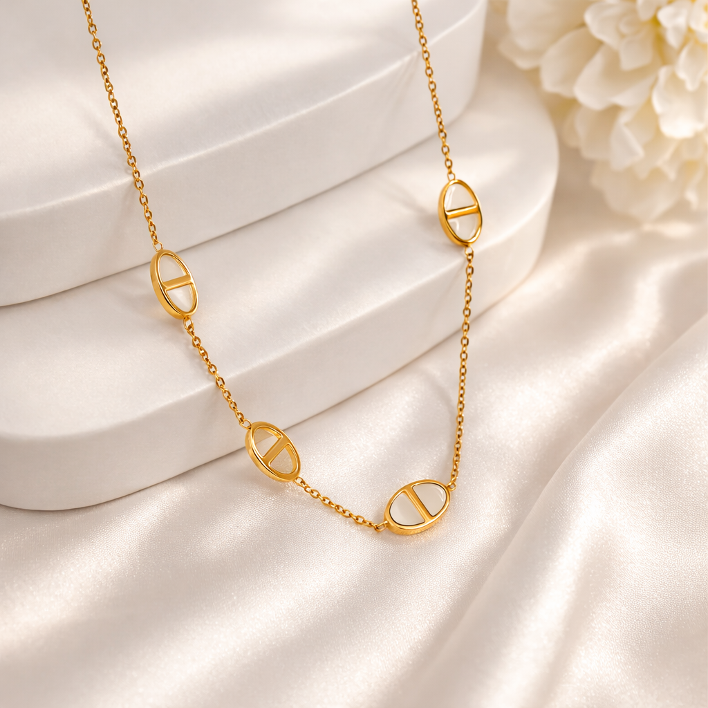 IVORY ORBIT CHARM NECKLACE