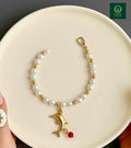 DOLPHIN-PEARL CHARM BRACELET